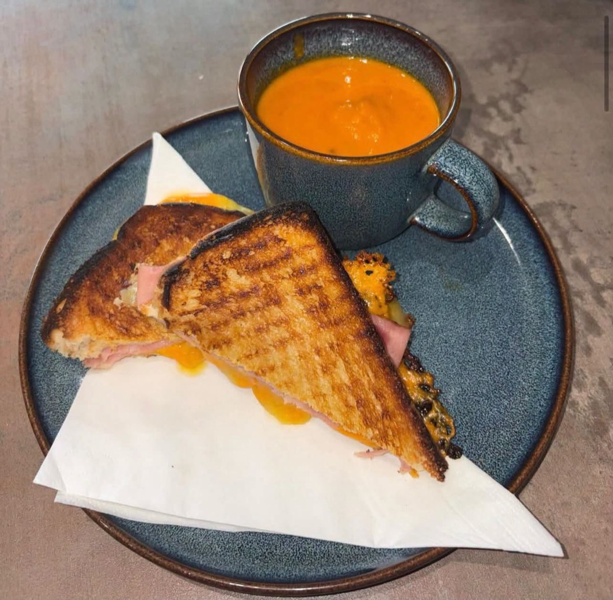 Toastie with a cup of tomato soup